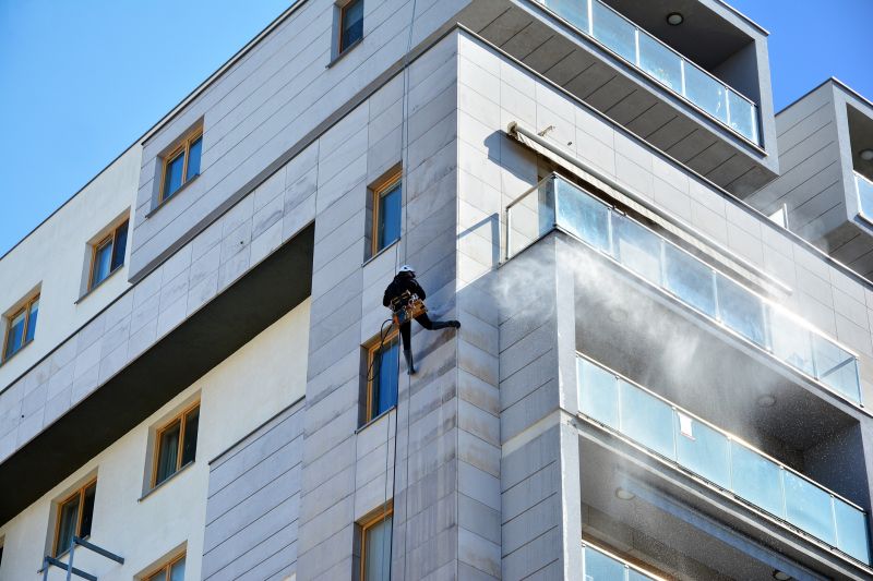 Powerwashing a building facade